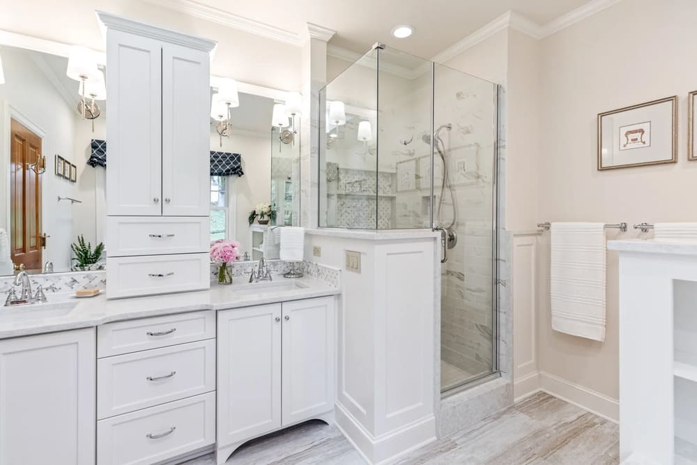 Newport bathroom remodel with white cabinets, walk-in shower